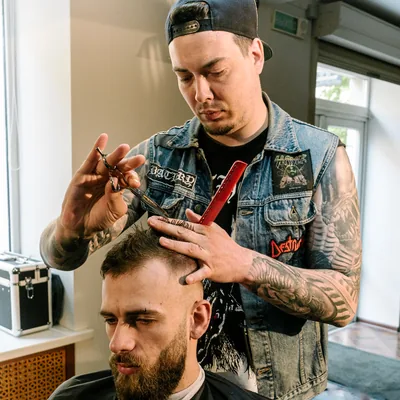 Barber giving a man a haircut